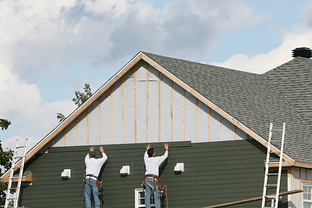 Professional Siding Contractor technician working in Selden, NY